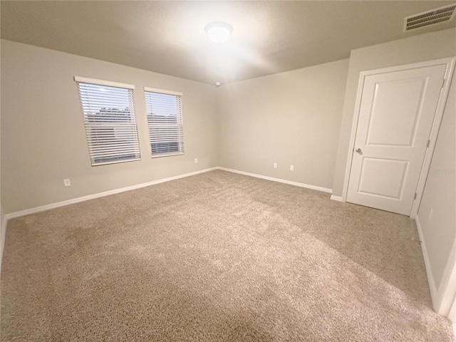 unfurnished room with carpet flooring