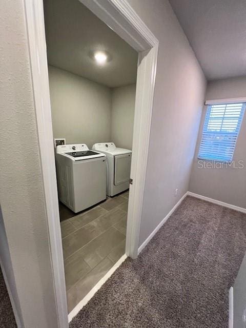 washroom featuring washing machine and dryer and carpet