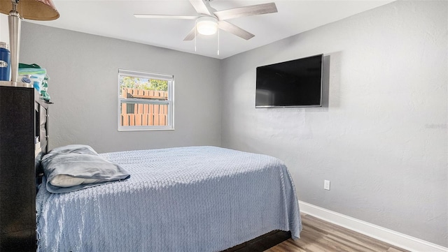 bedroom featuring wood-type flooring and ceiling fan