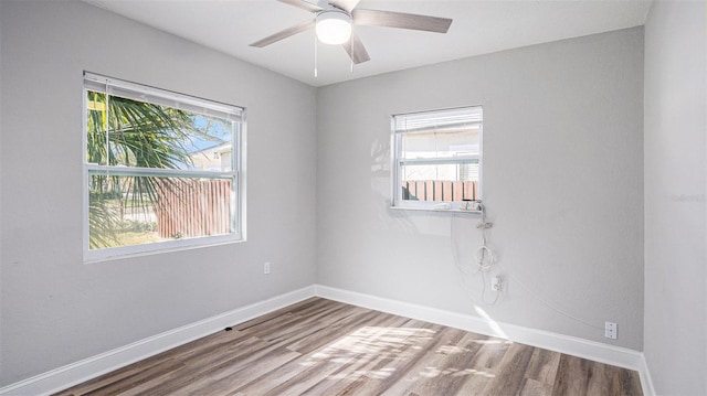 spare room featuring ceiling fan and wood-type flooring