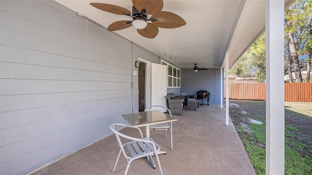 view of patio featuring ceiling fan