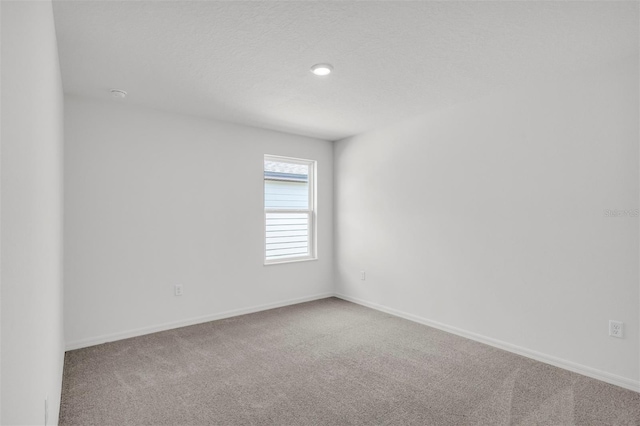 empty room with carpet flooring