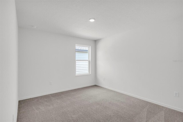 11 Prince Anthony Ln, Palm Coast, FL 32164 - empty room featuring carpet and baseboards
