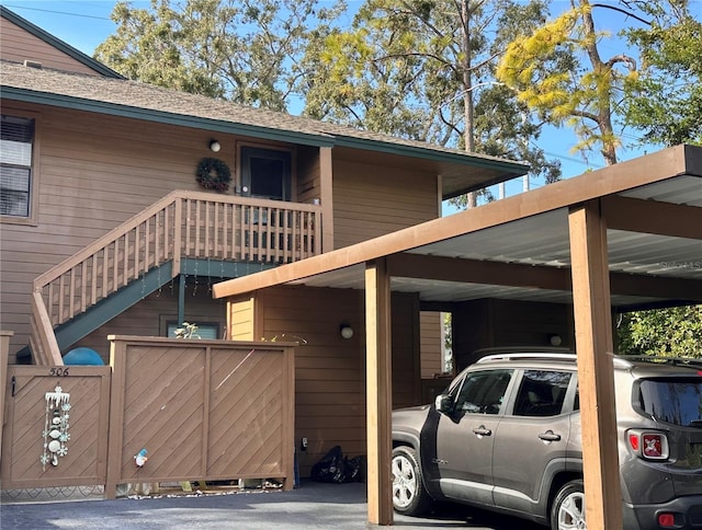 view of vehicle parking featuring a carport