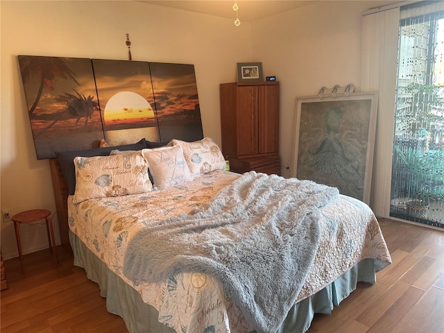 bedroom with wood finished floors