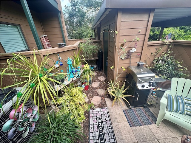 view of patio / terrace featuring area for grilling and fence