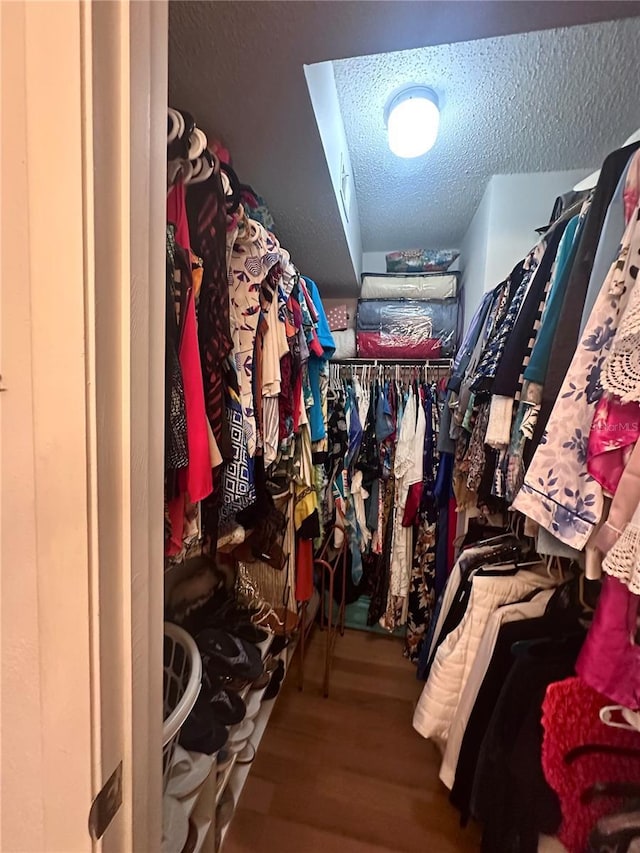 spacious closet featuring wood finished floors