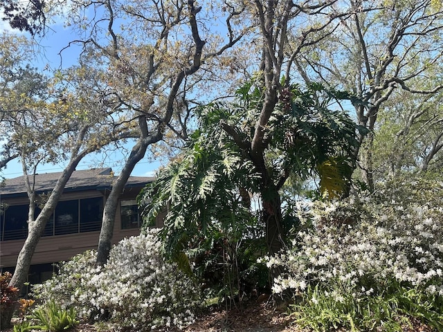 view of side of property with a sunroom