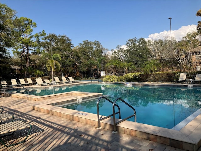 pool featuring a patio and fence