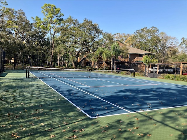 view of tennis court with fence