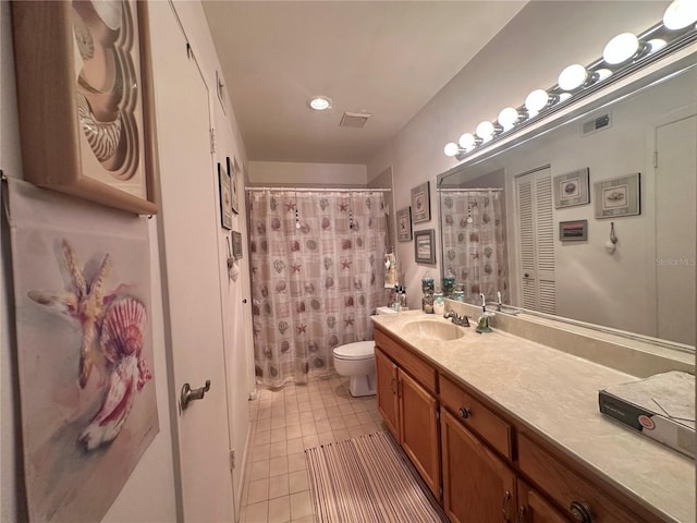 bathroom with tile patterned floors, visible vents, toilet, and vanity