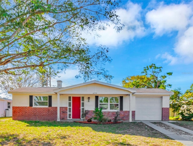 ranch-style home with a front yard and a garage