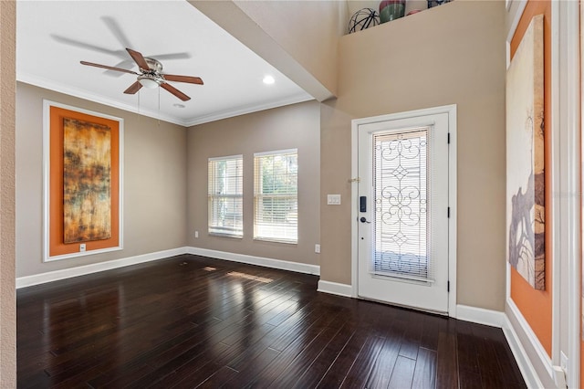 foyer entrance with crown molding, ceiling fan, and hardwood / wood-style flooring