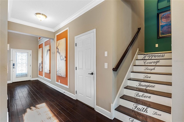 foyer with crown molding and dark wood-type flooring