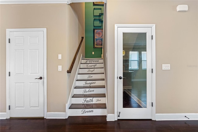 staircase with hardwood / wood-style flooring