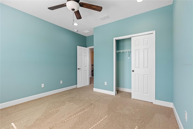 unfurnished bedroom with carpet flooring, a closet, and ceiling fan