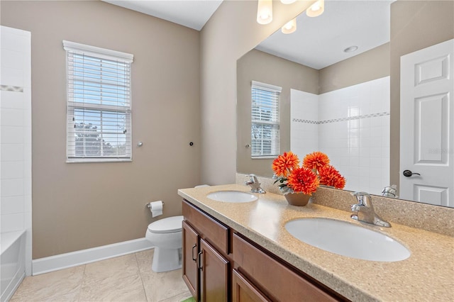 bathroom with tile patterned floors, vanity, and toilet