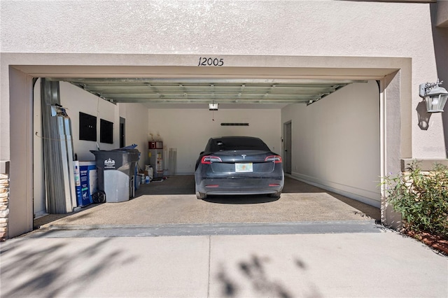 garage with a garage door opener and water heater