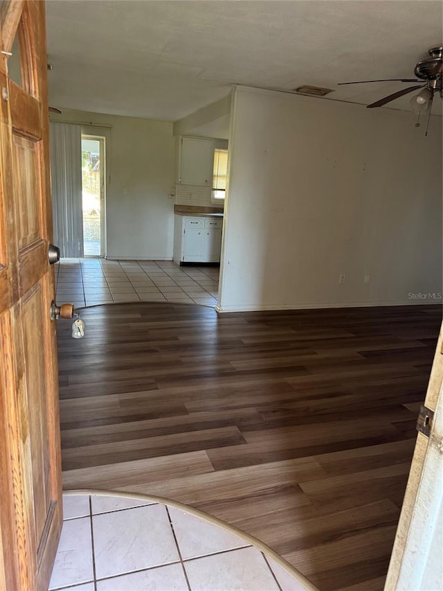 spare room featuring ceiling fan and light tile patterned floors