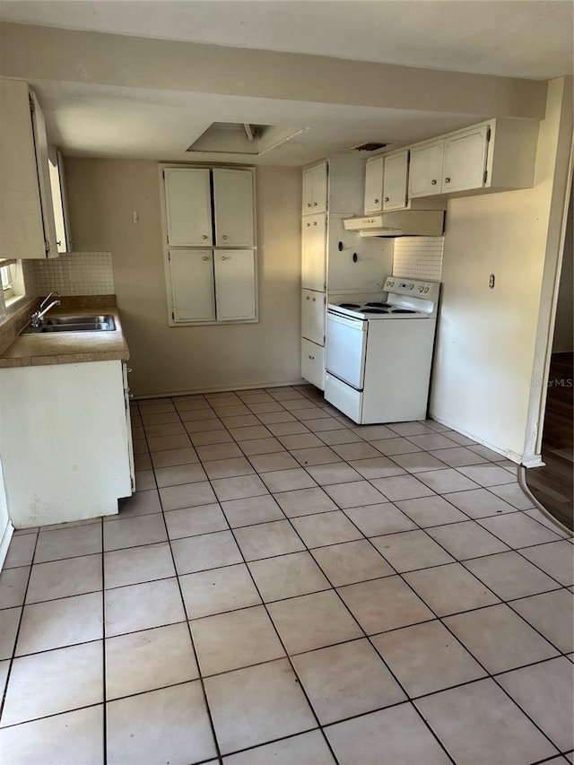 kitchen with white cabinets, sink, tasteful backsplash, white electric range oven, and light tile patterned flooring