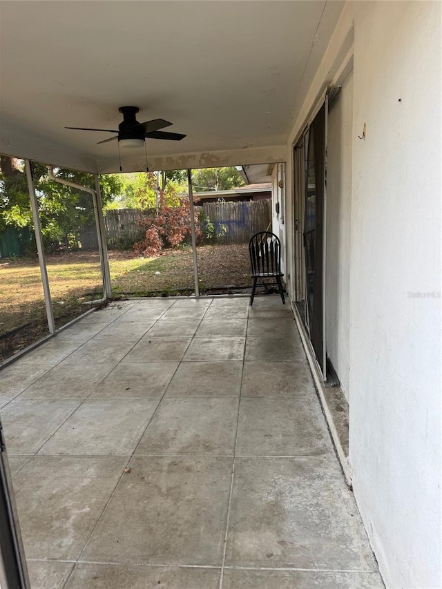 view of patio featuring ceiling fan