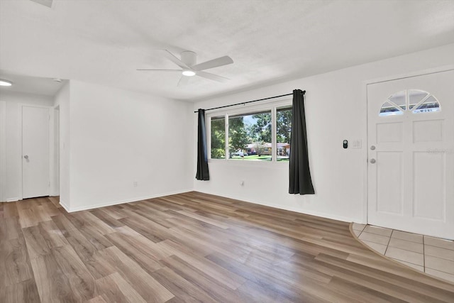 980 5th Ave NE, Largo, FL 33770 - foyer with a ceiling fan and light wood finished floors