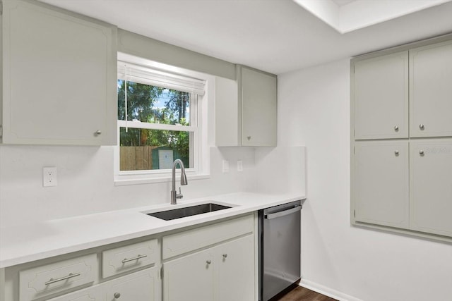 980 5th Ave NE, Largo, FL 33770 - kitchen with dishwasher, light countertops, and dark wood-type flooring