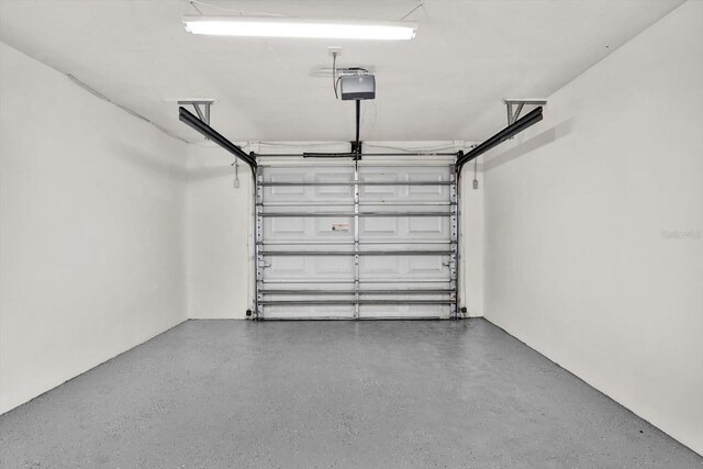 980 5th Ave NE, Largo, FL 33770 - garage featuring a garage door opener