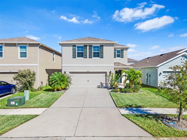 front facade with a front yard and a garage