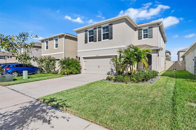 view of front of home with a front yard and a garage