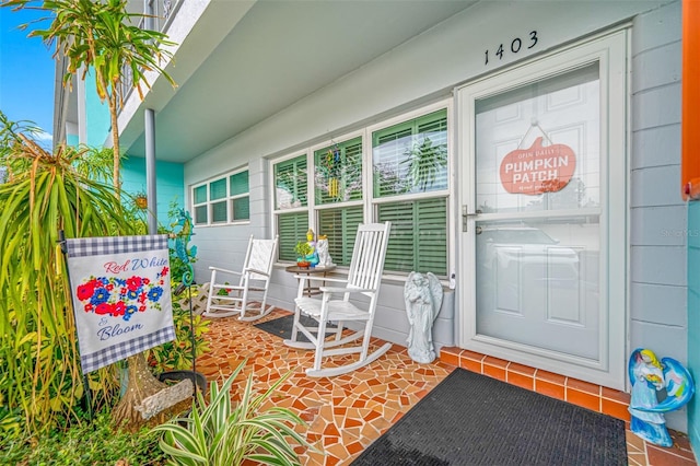 entrance to property featuring a porch