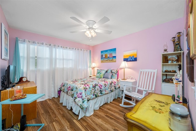 bedroom with hardwood / wood-style flooring and ceiling fan