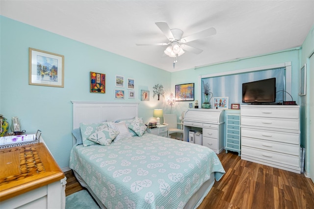 bedroom featuring dark hardwood / wood-style flooring and ceiling fan