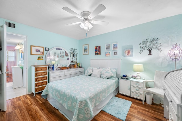 bedroom featuring hardwood / wood-style floors and ceiling fan