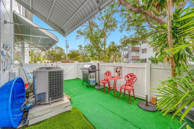 view of yard featuring central air condition unit