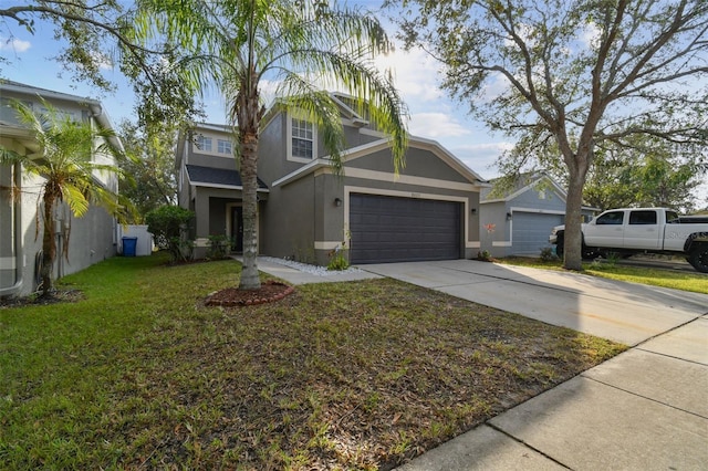 view of front of property featuring a garage and a front yard