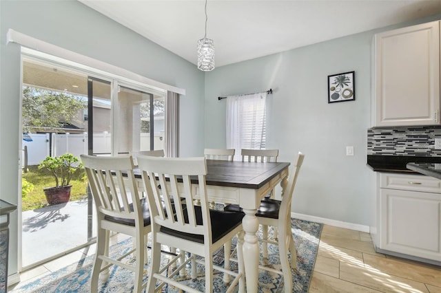 tiled dining area featuring plenty of natural light