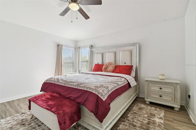 bedroom with wood-type flooring and ceiling fan