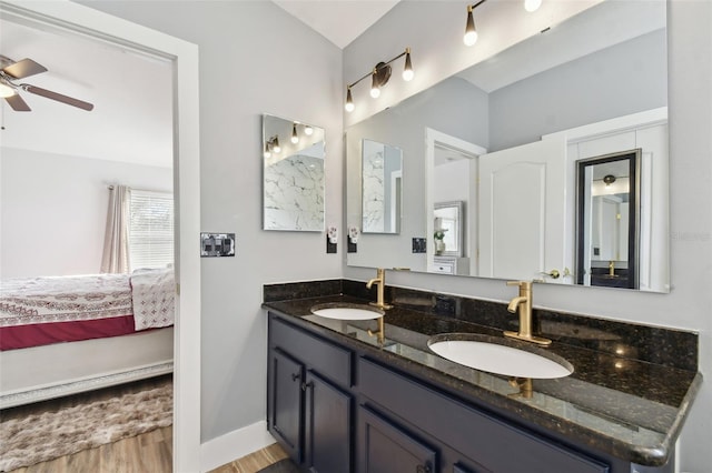 bathroom with vanity, ceiling fan, and wood-type flooring