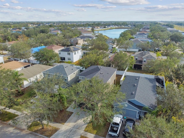 drone / aerial view with a water view