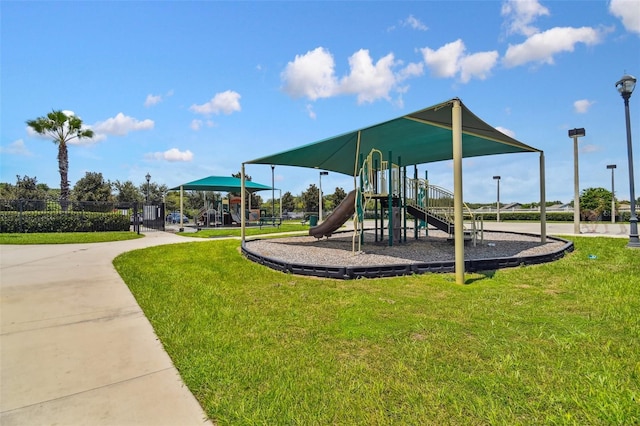 view of playground featuring a lawn