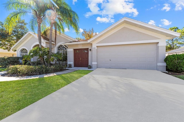 ranch-style home with a front lawn and a garage