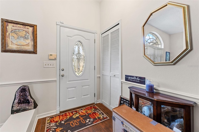 foyer with dark hardwood / wood-style flooring