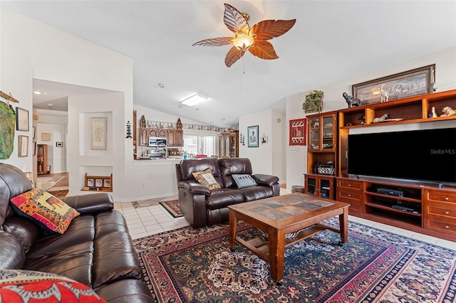 living room with tile patterned flooring, ceiling fan, and lofted ceiling