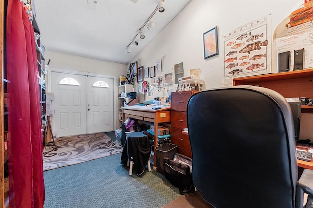 office featuring carpet and rail lighting