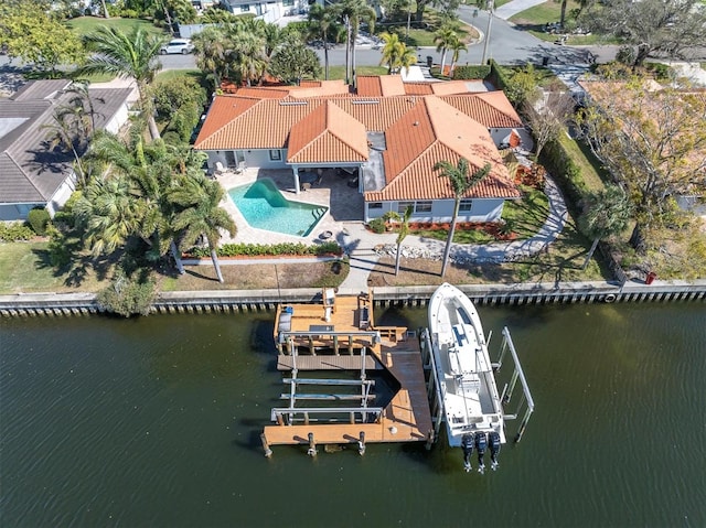 birds eye view of property with a water view