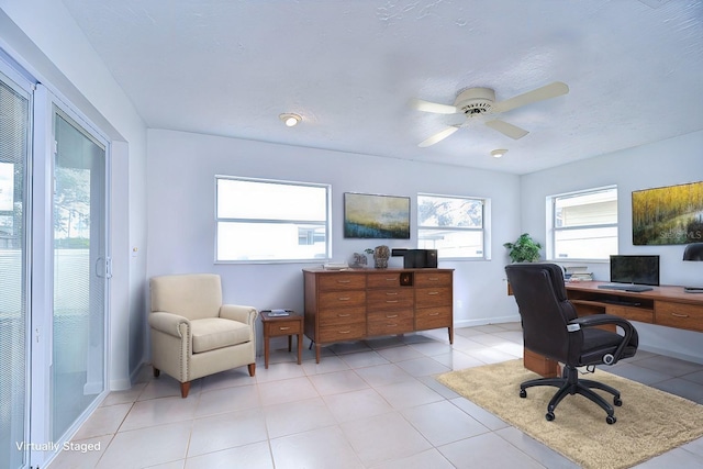 tiled home office with ceiling fan