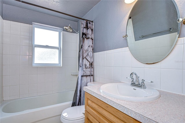 full bathroom with decorative backsplash, shower / tub combo, vanity, tile walls, and toilet