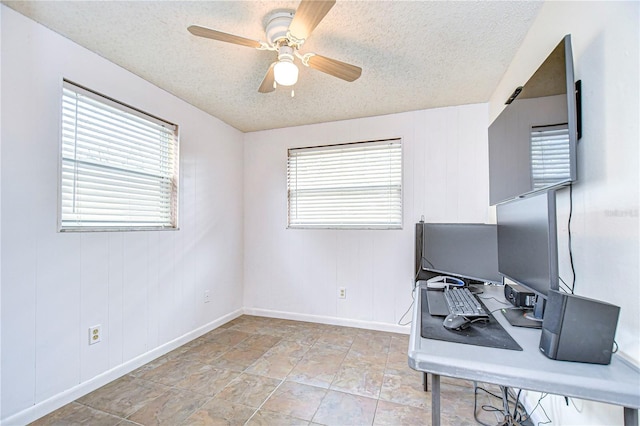 office featuring a textured ceiling and ceiling fan