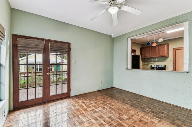 interior space featuring ornamental molding, french doors, and ceiling fan